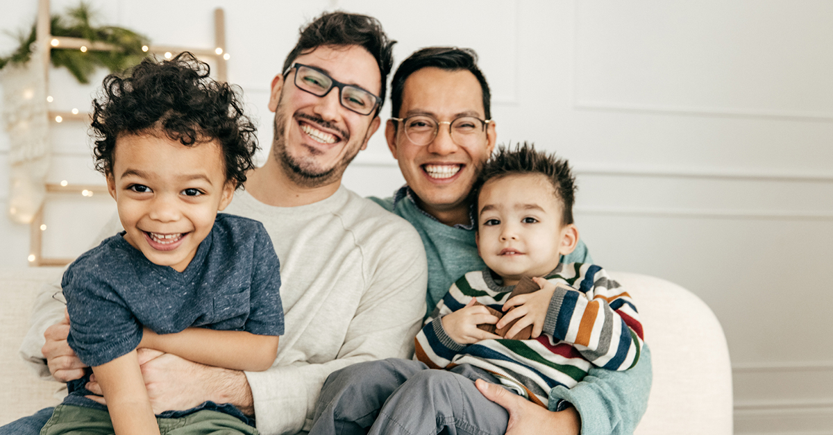 A same-sex couple spends time with their kids