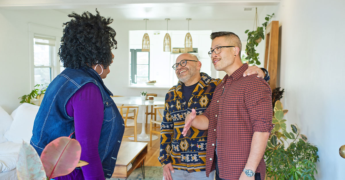 A same-sex couple looks at a home